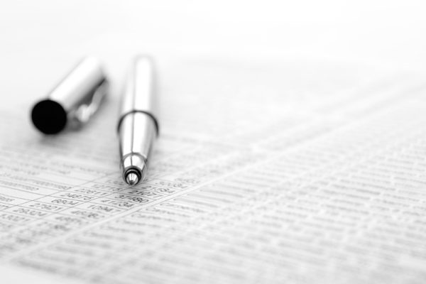 ink pen and documents with the records for business